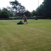 Getting the green ready at Ellesmere Bowling Club.