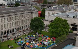 Students taking part in an encampment protest over the Gaza conflict on the grounds of Trinity College in Dublin (Niall Carson/PA)