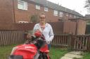 Alice MayJones, 26, with her damaged Honda motorcycle. Miss Jones crashed on the A41 near Whitchurch