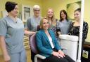 Helen Morgan MP (seated) with staff from Green End Dentists in Whitchurch.