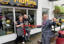 Emma and David Martin look on as Whitchurch mayor Cllr Andy Hall cuts the ribbon.