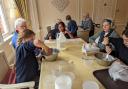 Generations unite over goo and giggles as Malpas Alport School children share the sticky delight of slime-making with the residents of Prospect House Care Home.