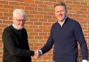 Halls managing director Jon Quinn (left) with David Owen following the signing of the deal to acquire Shenton Owen Planning and  Design.