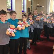 Pupils from Tilstock CE Primary School with the teddy bears.