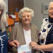 Margaret Bowen (centre) hands the cheque to Ruth Philp and Penny Harrison.