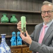 Halls Fine Art’s Asian art specialist Alexander Clement with the Japanese cloisonne vase that sold for £11,000.