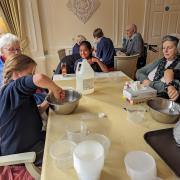 Generations unite over goo and giggles as Malpas Alport School children share the sticky delight of slime-making with the residents of Prospect House Care Home.