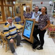 Arthur Hulme, a guest at the centre, manager Mandy Silvester, Cllr Andy Hall, and fundraiser Millie Wilson with the new table.