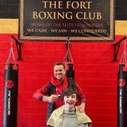 Daniel Bailey and Archie Hughes get ready for the head shave at Fort Boxing Club.