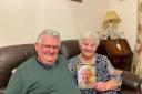 John and Beryl Owen with their anniversary card from the Queen.