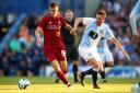 Liverpool's Ben Woodburn and Blackburn Rovers' Corry Evans battle for the ball during a pre season friendly match at Ewood Park, Blackburn..