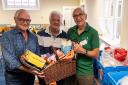 Whitchurch Rotary president Graham King (left) and the club’s Community Services chair Phil Leigh present some of their £1,000 worth of food to Alan Scutt of Whitchurch Foodban