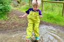 A youngster puddle jumping at Cheshire's BeWILDerwood.