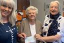 Margaret Bowen (centre) hands the cheque to Ruth Philp and Penny Harrison.