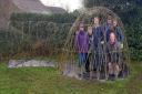 Clive’s Renshaw’s Field Association pose in their willow dome.