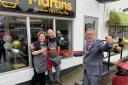 Emma and David Martin look on as Whitchurch mayor Cllr Andy Hall cuts the ribbon.