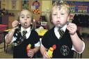 Pupils from the Kindergarden at The White House School, Whitchurch, blowing bubbles as part of their topic All About Myself in 2009.