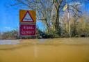 File photo dated 02/03/20 of a 'Road closed' sign poking out above floodwater and alerting motorists of flooding. More than 5,000 new homes in areas at higher risk of flooding in England have been approved to be built in this year, according to a
