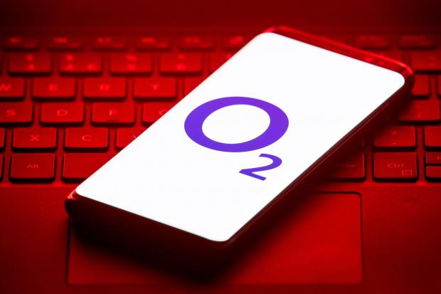 Whitchurch Herald: O2 logo displayed on a phone sitting on a keyboard. Credit: PA