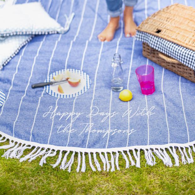 Whitchurch Herald: Personalised Round Blue Picnic Or Beach Blanket. Credit: Not On The High Street