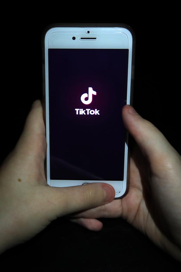 Whitchurch Herald: A person with TikTok open on their phone. Credit: PA