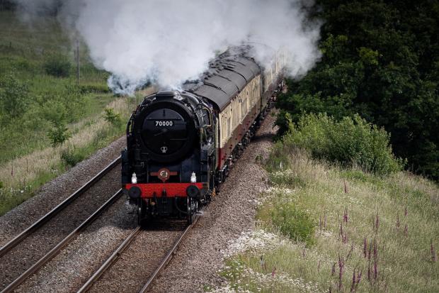 Whitchurch Herald: Steam locomotive 'Britannia' heading down the hill towards Whitchurch. Picture by Steve Beech.