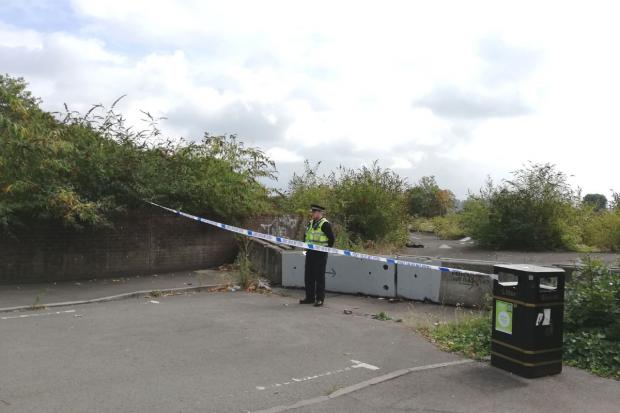 A police officer at the cordon outside the former Sainsbury's site in the Shaftesbury area of Newport.