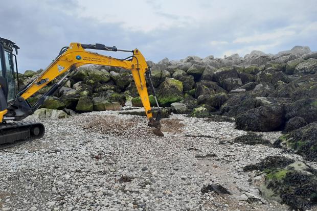 Natural Resources Wales clears the Afon Ganol’s east outfall at Penrhyn Bay. Photo: NRW / Facebook