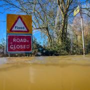 File photo dated 02/03/20 of a 'Road closed' sign poking out above floodwater and alerting motorists of flooding. More than 5,000 new homes in areas at higher risk of flooding in England have been approved to be built in this year, according to a