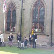 Armed Forces Day service taking place outside St Peter and St Paul Church in Wem.