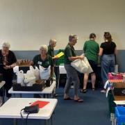 Volunteers picking the parcels to support families.