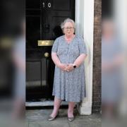 Jackie Weaver stood outside the show's fake No10. Picture: Channel 4/PA.