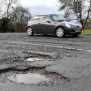 Complaints about potholes were raised in the town council meeting.