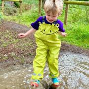 A youngster puddle jumping at Cheshire's BeWILDerwood.