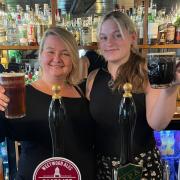 General manager Gem Dimelow with Supervisor and right hand lady Emily Wynne- Edwards celebrate beer success at The Black Bear in Whitchurch.
