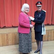Pauline Dee receiving her BEM from Shropshire Lord Lieutenant Anna Turner.