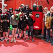 (from right) Dan Bailey, Phil Leigh and Graham King with youngsters from the Fort Boxing Club.