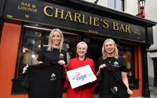 Una Burns (left), manager of Charlie’s Bar Enniskillen and Sarah Thompson (right), founder of embroidery company Ted & Stitch with Siobhan Casey from Age NI (Fiona Brown Communications/PA)